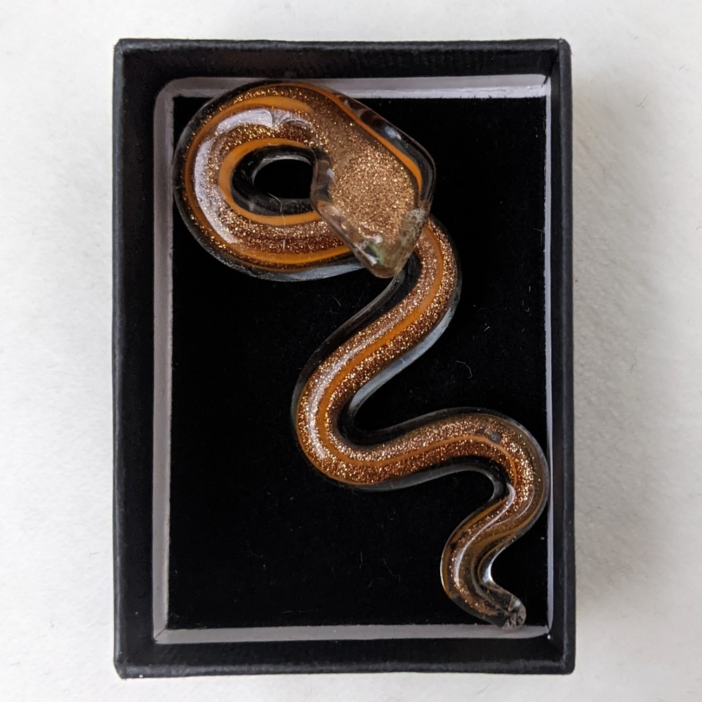 Glass serpent pendant